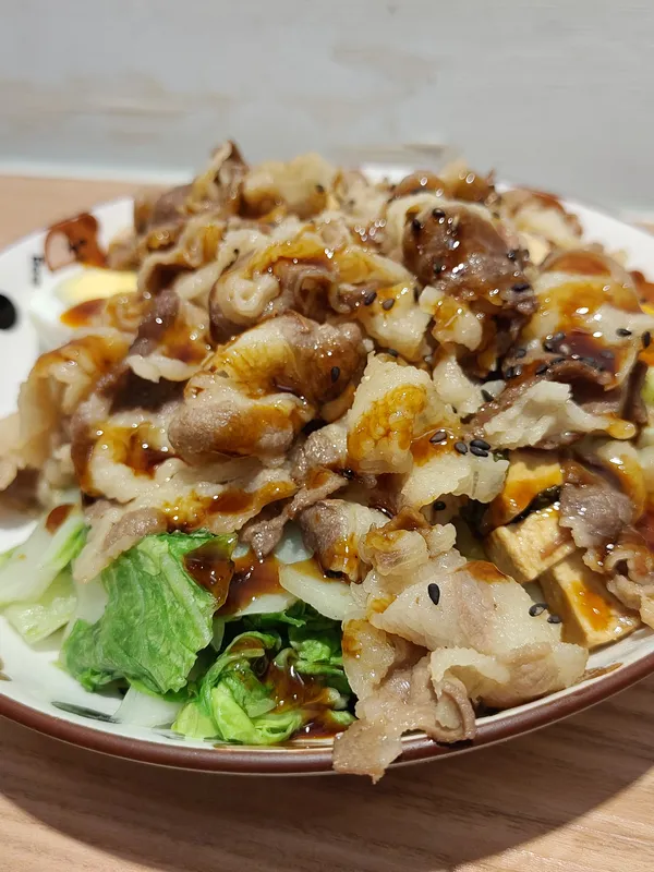 Pork with black rice and teriyaki sauce