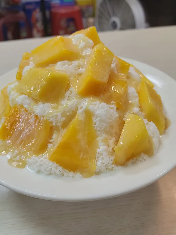Mango shaved ice with condensed milk.